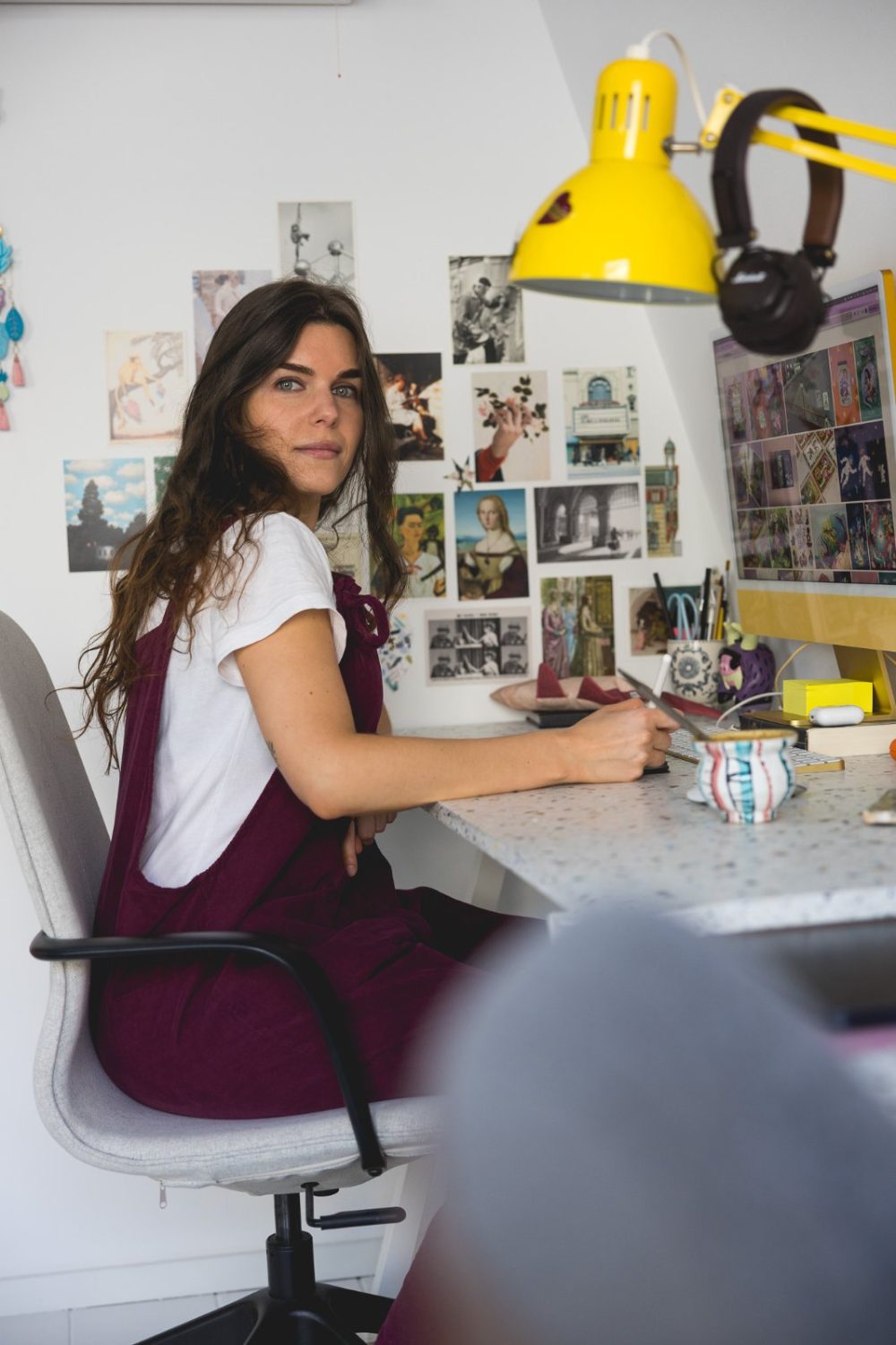 Asia Orlando at her desk